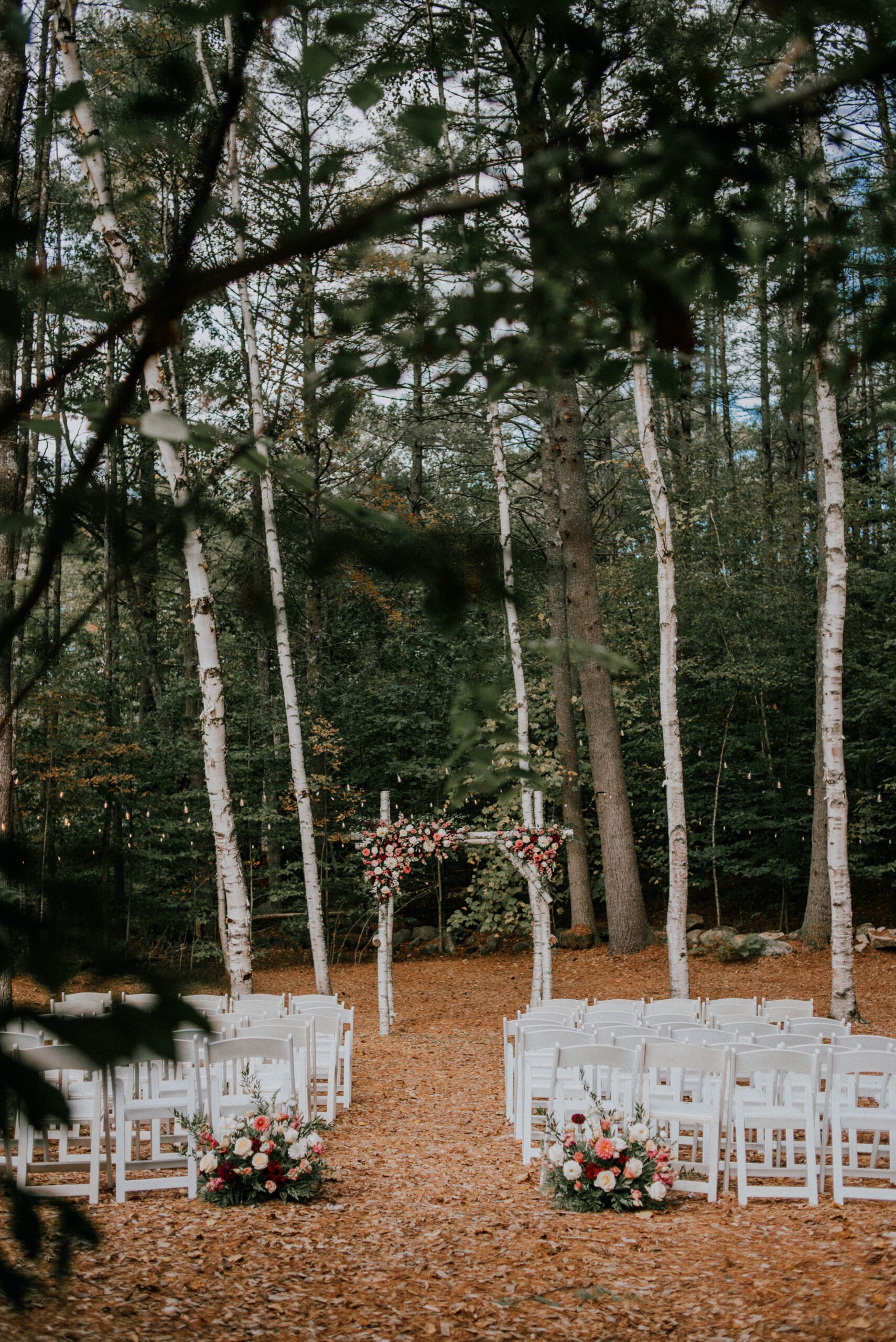 outdoor wedding ceremony surrounded by woods