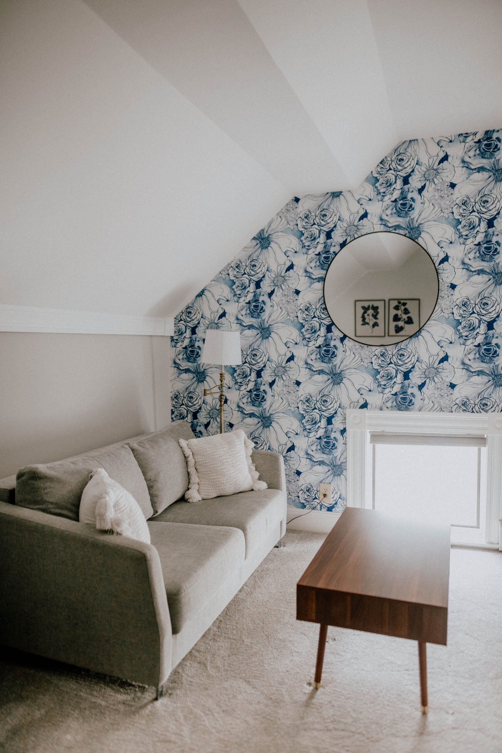 cozy sitting area with blue and white floral wallpaper