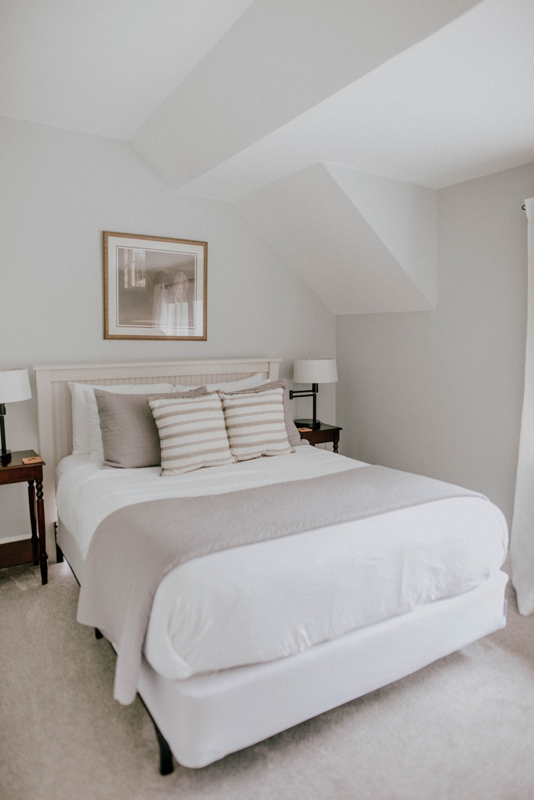 queen bed with white and grey linens