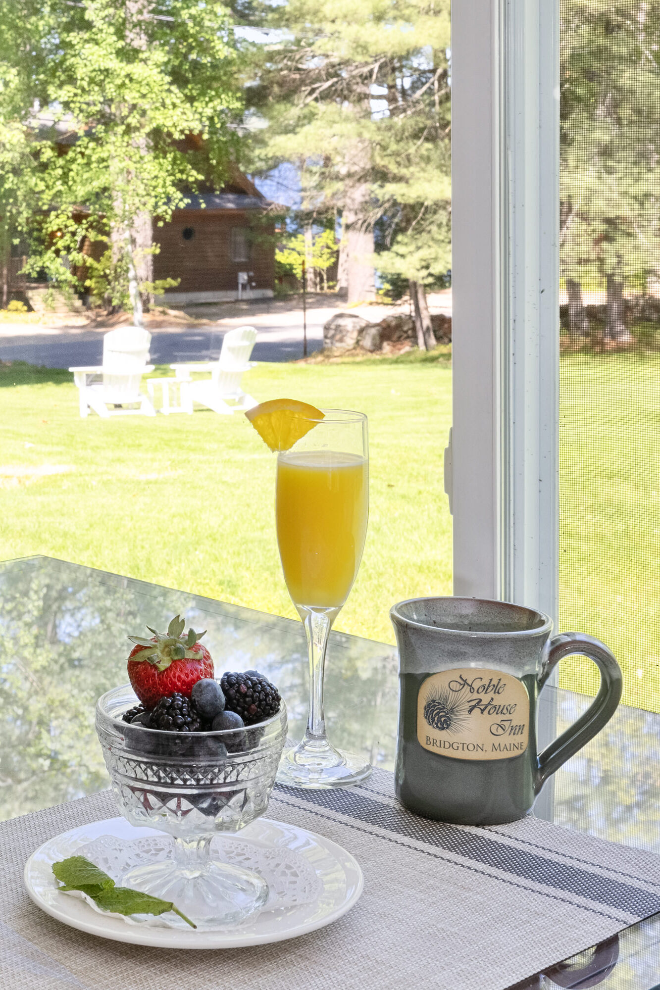 mimosa and bowl of fruit