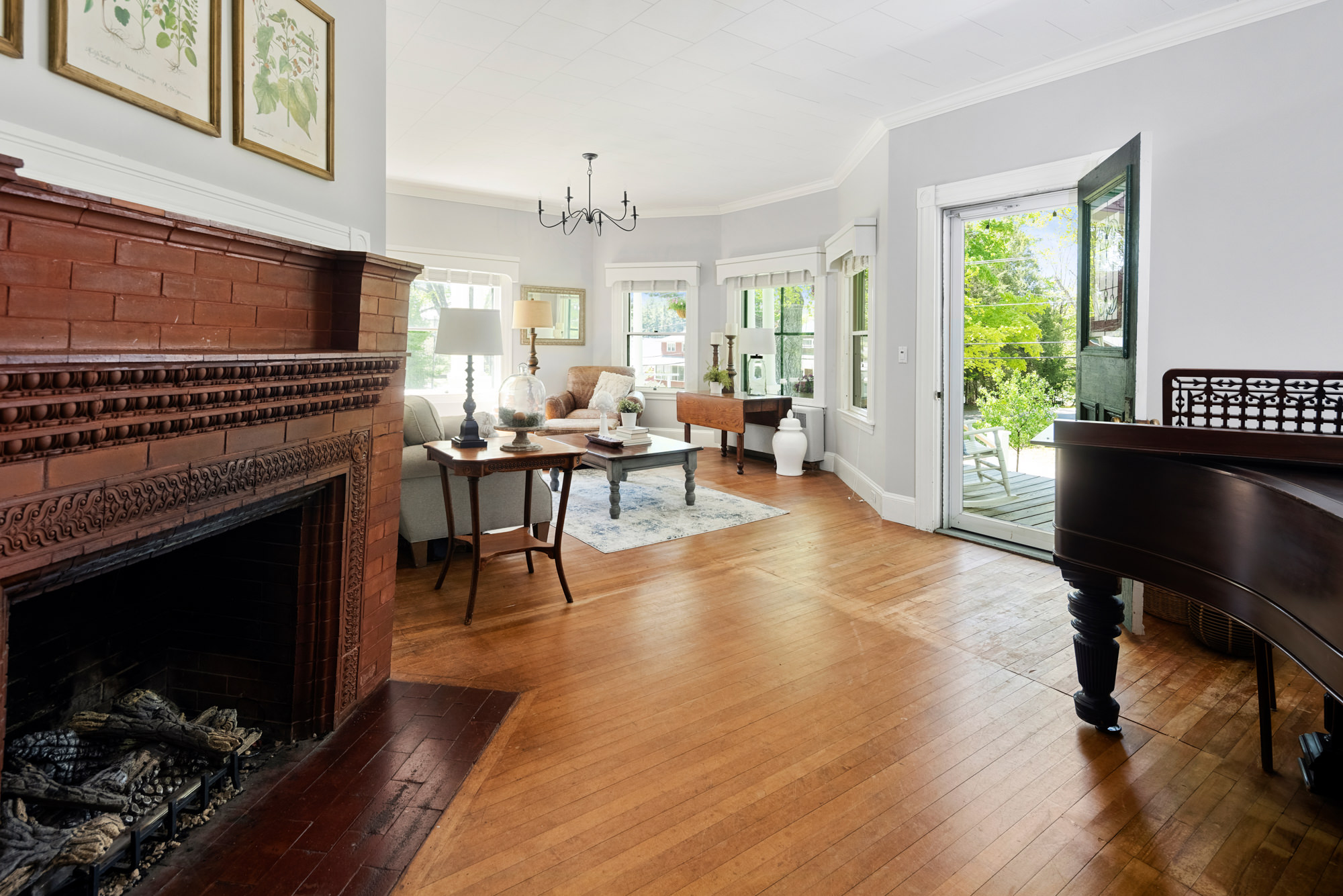 fireplace and piano in noble house inn sitting room