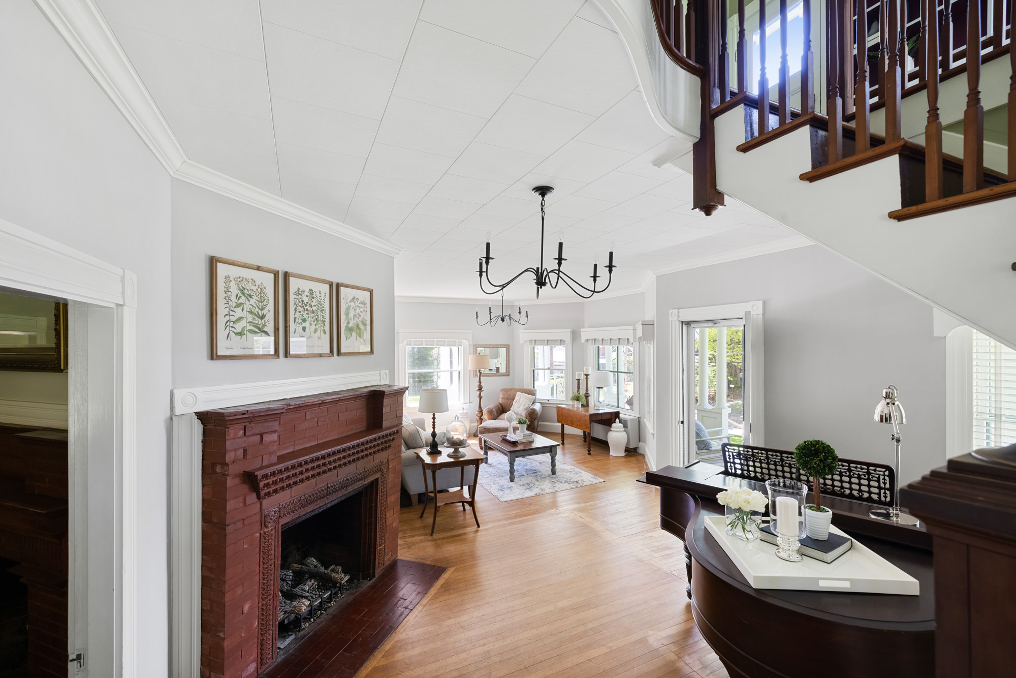 sitting room of noble house inn with piano and fireplace