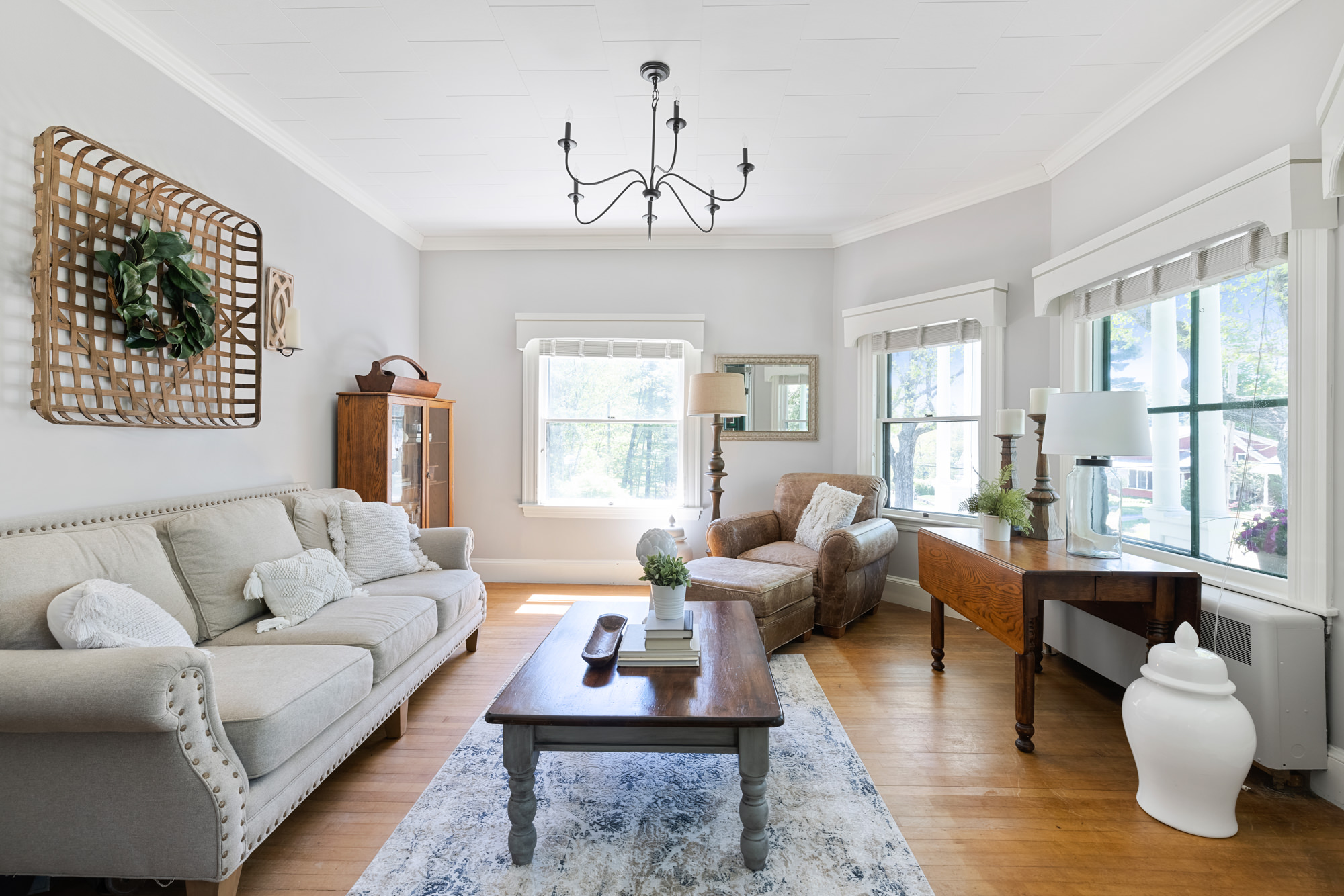 sitting room with neutral and antique furnishings