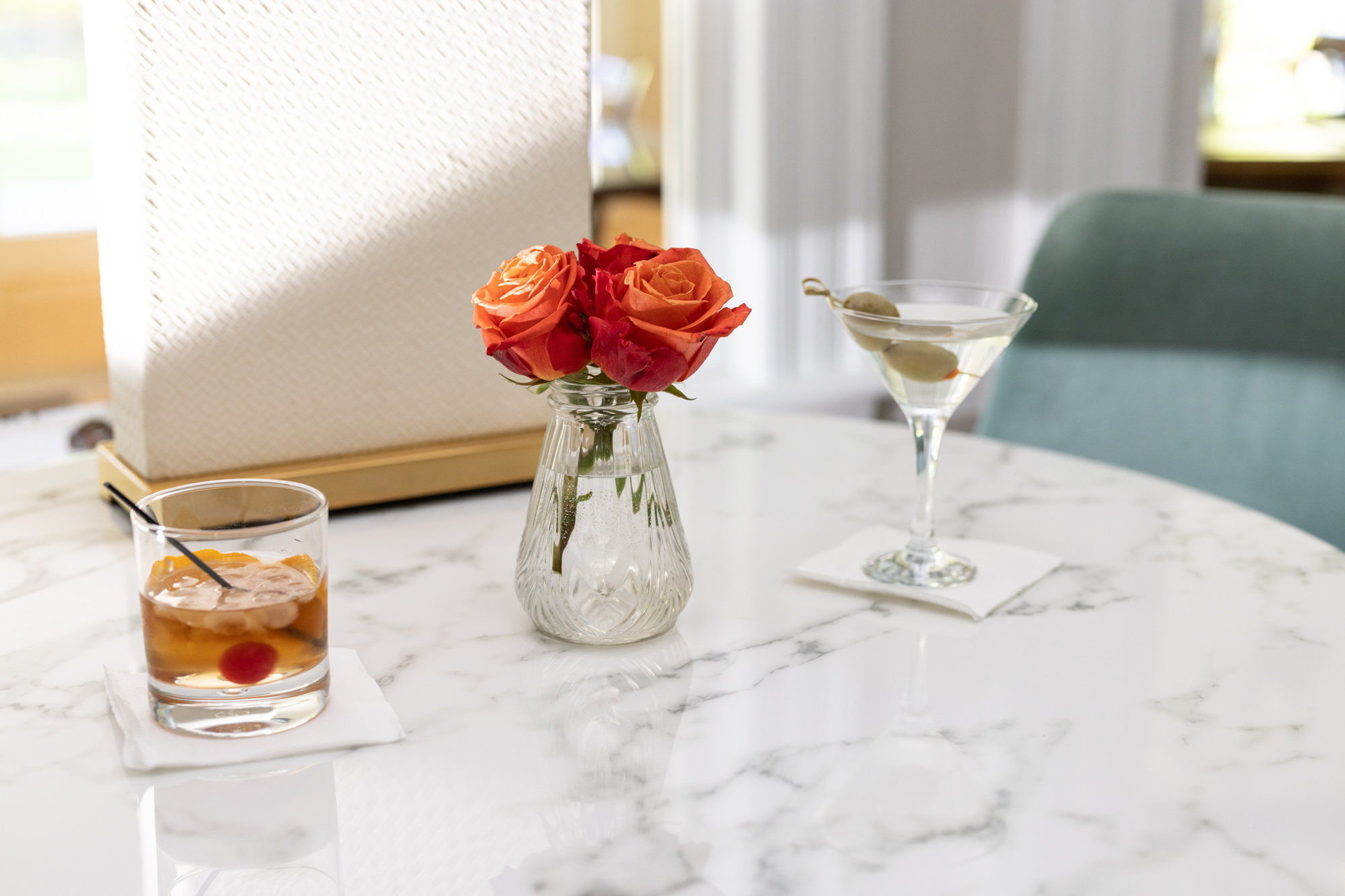 martini and whiskey cocktail on table at noble house inn bar