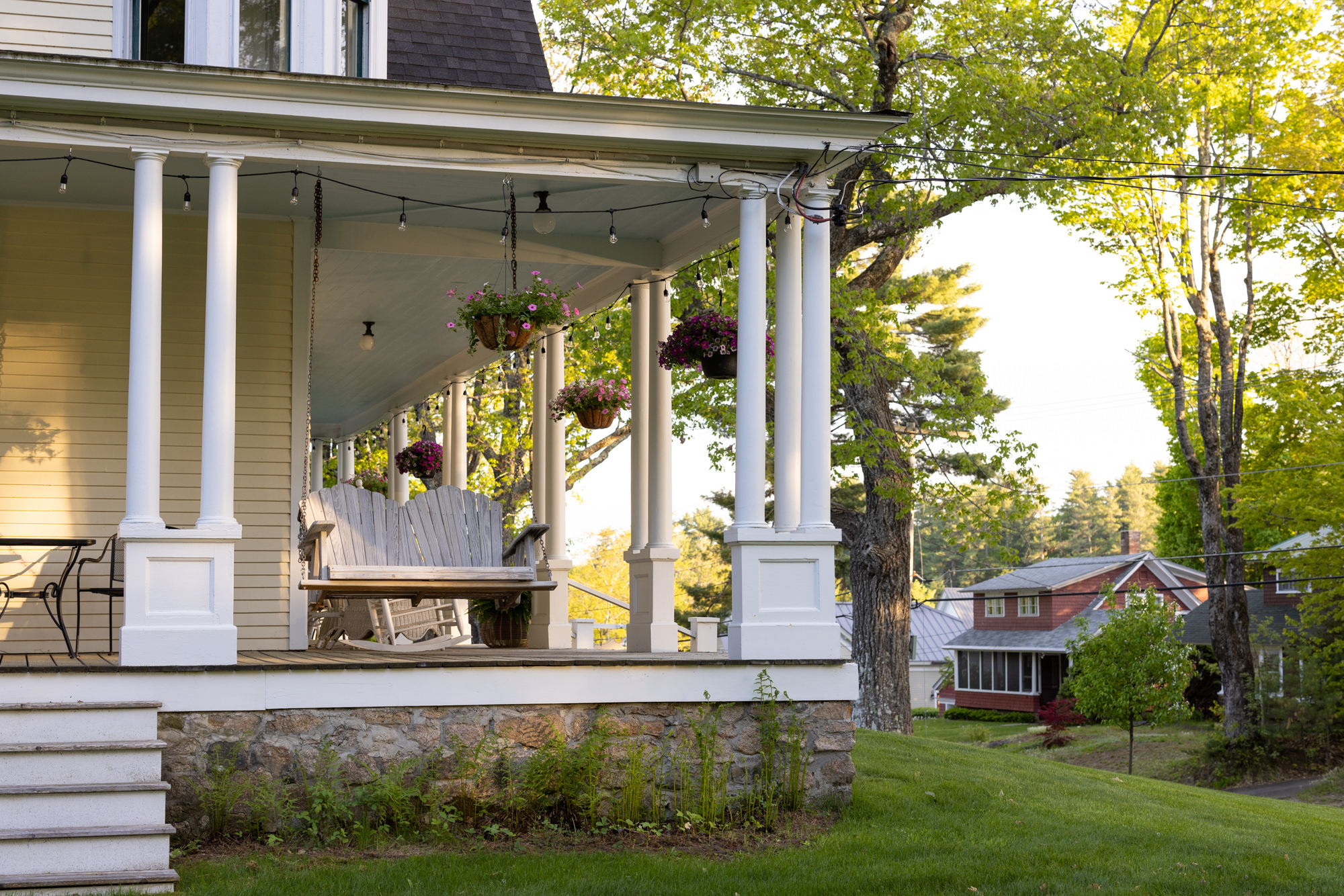 wooden porch swing at noble house inn
