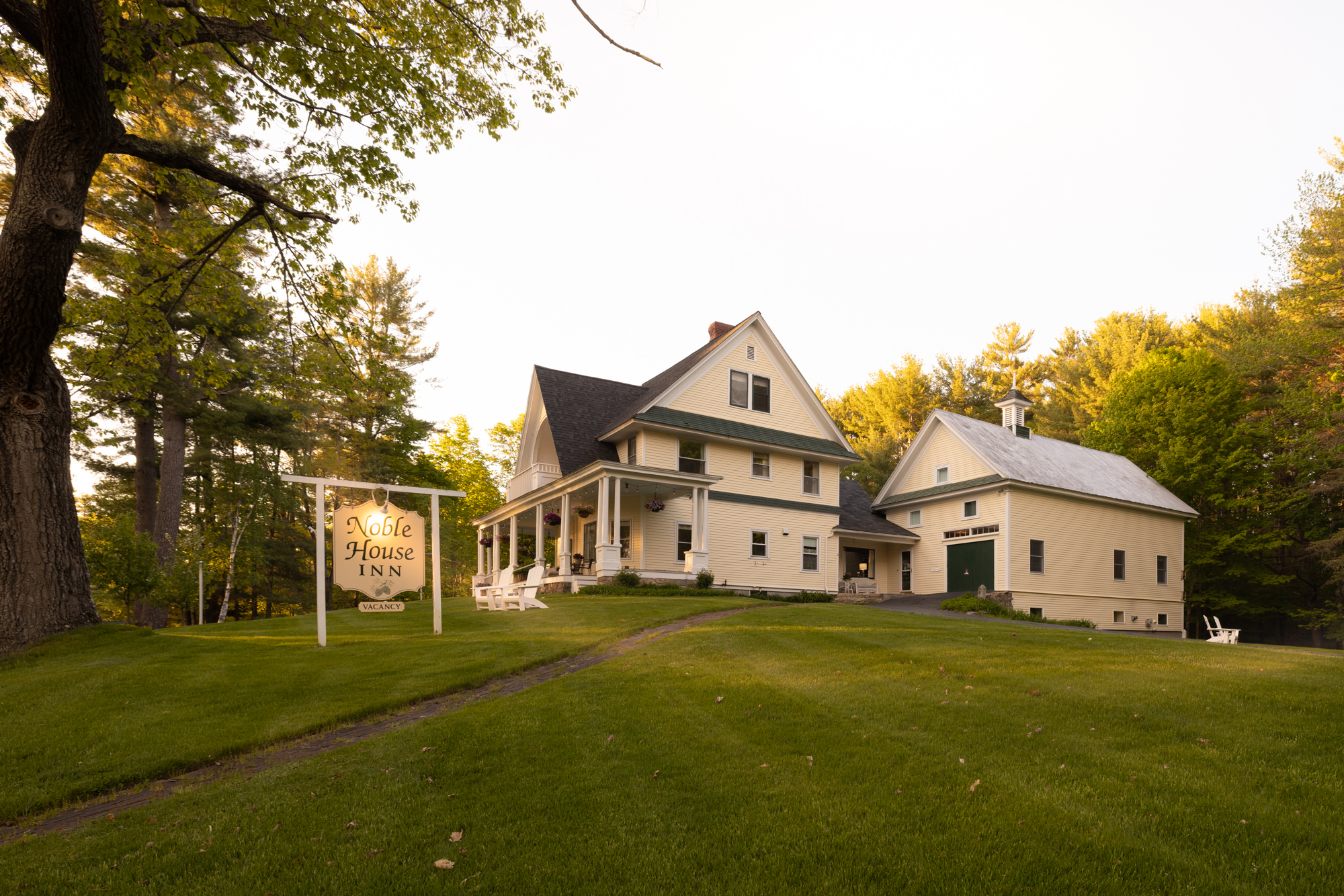 exterior of noble house inn at sunset